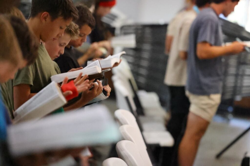 Junior high students reading their Bibles